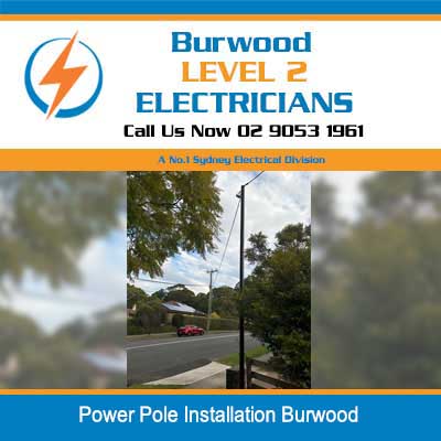 Power pole installation with overhead lines on residential street in Burwood