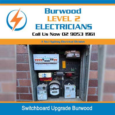 Open electrical switchboard upgrade with multiple circuit breakers, meters, and safety switches in Burwood